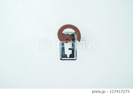 Mosquito coils with a silver object in the middle 117417275