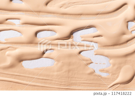 Abstract delicate minimalist beige background, cosmetic cream stroke on white. 117418222