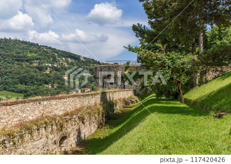 Brescia castle wall with embankment, watchtower, and greenery Brescia castle wall with embankment, watchtower, and greenery 117420426