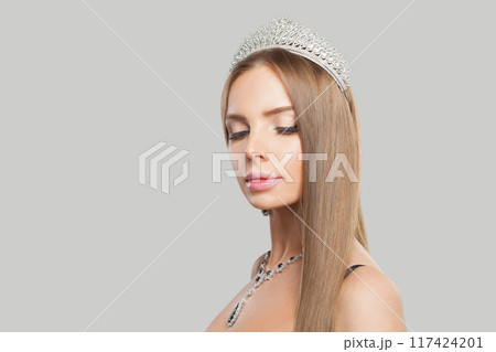 Indoor portrait of jewellery model woman wearing stylish gold necklace Indoor portrait of jewellery model woman wearing stylish gold necklace 117424201