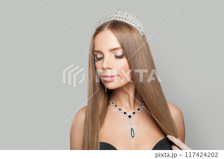 Glorious glamorous jewellery woman wearing jewelry crown tiara with diamond posing Glorious glamorous jewellery woman wearing jewelry crown tiara with diamond posing 117424202