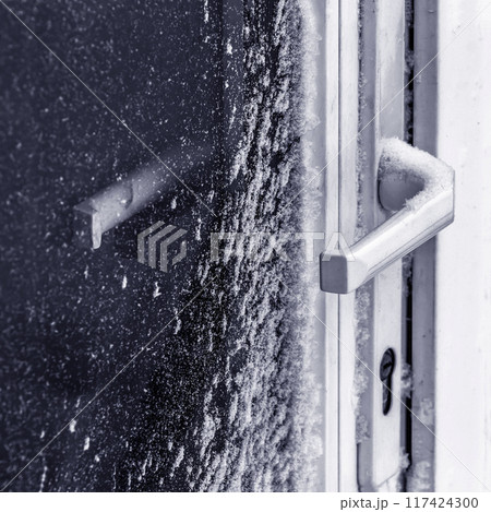 The door is covered with snow 117424300