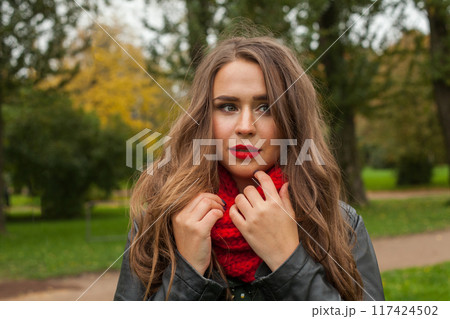 Cheerful autumn woman in fall park, outdoor portrait 117424502