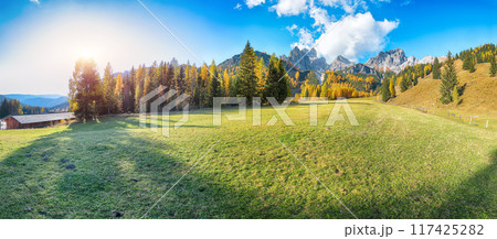 Astonishing view of mountains and valleys with larch forest and wonderful sky are located in Filzmoos Astonishing view of mountains and valleys with larch forest and wonderful sky are located in Filzmoos 117425282