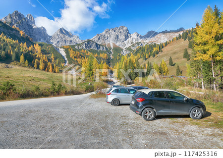 Gorgeous view of mountains and valleys with larch forest and wonderful sky are located in Filzmoos Gorgeous view of mountains and valleys with larch forest and wonderful sky are located in Filzmoos 117425316