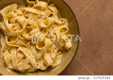 Fettuccine, tagliatelle, in creamy garlic sauce, Italian traditional cuisine, pasta carbonaro, Fettuccine, tagliatelle, in creamy garlic sauce, Italian traditional cuisine, pasta carbonaro, 117425384