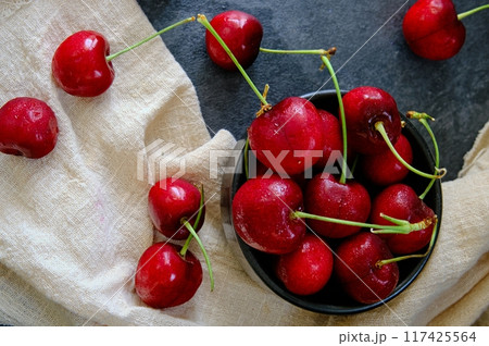 ripe cherries on a dark background 117425564