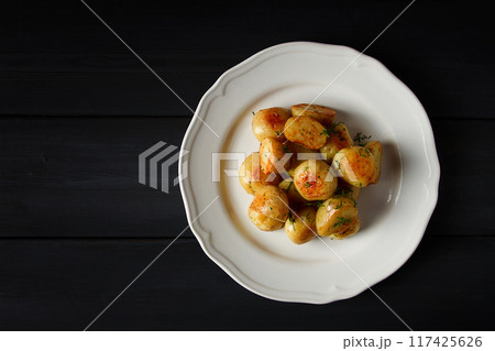 Fresh Cooked, new potatoes,with dill, on a wooden table, selective focus. close-up, toning, no people, 117425626