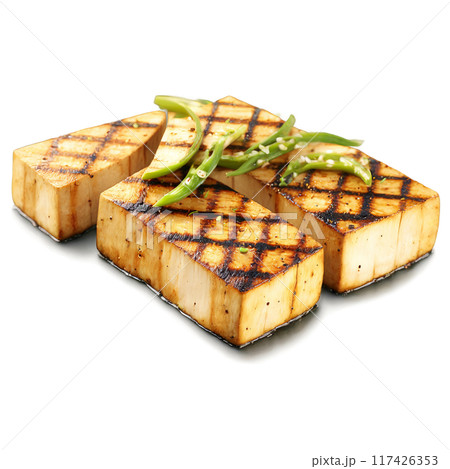 Grilled tofu steaks with grill marks and a sprinkle of chopped scallions Summer food concept Grilled tofu steaks with grill marks and a sprinkle of chopped scallions Summer food concept 117426353