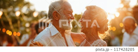 Happy senior couple dancing. Middleaged peope dancing at an outdoor party. Outdoor wedding party 117428205
