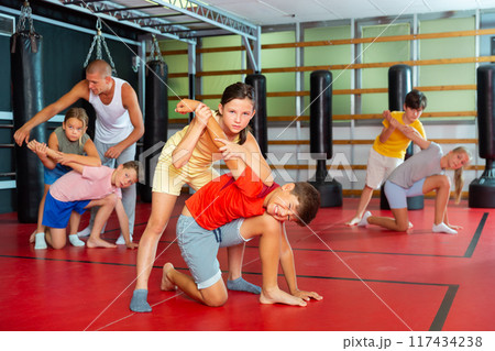 Young boys and girls on self-defence training Young boys and girls on self-defence training 117434238