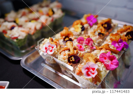 tartlets with pate and salad garnished with flowers. Delicious appetizers. 117441483