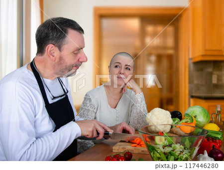 Kitchen Love: Husband Prepares Healthy Meal for Wife Battling Cancer, Demonstrating Unwavering Support and Affection During Tough Times. Kitchen Love: Husband Prepares Healthy Meal for Wife Battling Cancer, Demonstrating Unwavering Support and Affection During Tough Times. 117446280