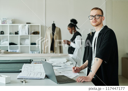 Serious man in eyeglasses and blazer Serious man in eyeglasses and blazer 117447177