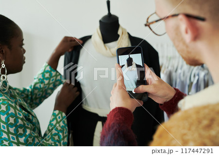Smartphone with mannequin on screen Smartphone with mannequin on screen 117447291