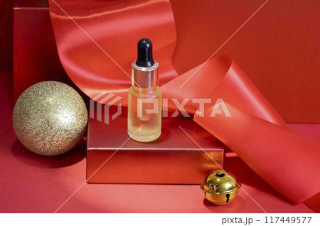 Holiday Glow - Presenting skincare products in festive packaging designed to shine during the holiday christmas season 117449577