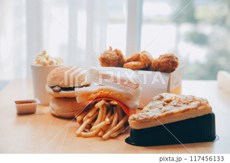 Closeup of home made burgers on wooden background 117456133