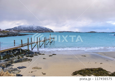 Sommaroy islands and arctic sea near Tromso Norway. Sunset over snowy small islands 117456575