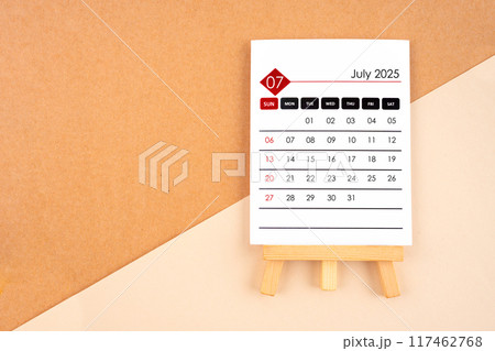 2025 July calendar page on brown background. 117462768