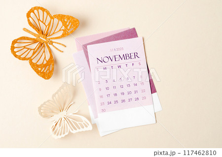 November 2025 calendar card for the organizer to plan and reminder and butterfly paper on yellow. November 2025 calendar card for the organizer to plan and reminder and butterfly paper on yellow. 117462810