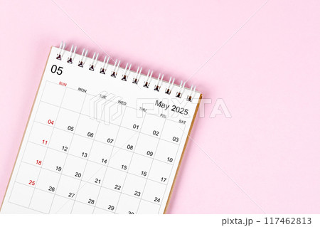 May 2025 desk calendar on pink background, Position with empty space. 117462813