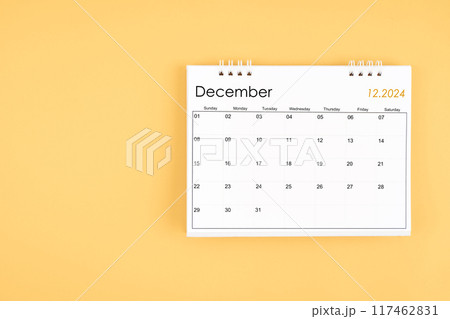 December 2024 desk calendar on yellow color background, position with copy space. 117462831