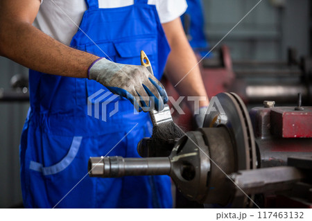 Engineering worker cleaning working machine lathe metal brake disc grinder Engineering worker cleaning working machine lathe metal brake disc grinder 117463132