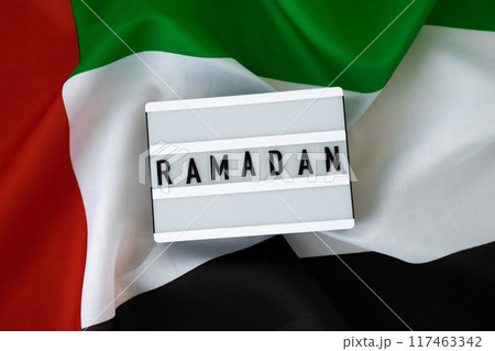 Congratulations Lightbox with text RAMADAN waving UAE flag on background concept. Greeting card advertisement. Commemoration Day Muslim Blessed holy month holiday 117463342