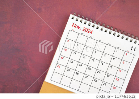 November 2024 desk calendar on red background. November 2024 desk calendar on red background. 117463612