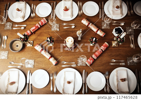 Above, table and dinner in home for Christmas with plate or decor for family reunion, gathering and celebration. Brunch, buffet and feast or food in desk for thanksgiving with cutlery in dining room Above, table and dinner in home for Christmas with plate or decor for family reunion, gathering and celebration. Brunch, buffet and feast or food in desk for thanksgiving with cutlery in dining room 117465628