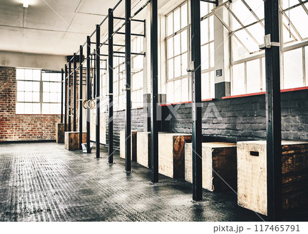 Equipment, pull up bars and fitness in gym for exercise, workout and bodybuilding or health. Wellness, jump or plyo boxes in training centre for sports, muscle strength and power with empty room 117465791