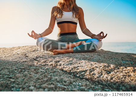 Outdoor, meditation and woman with chakra for yoga, wellness and spiritual peace in California. Zen, female yogi and hands with lotus pose for calm, relaxing and mental health on beach in nature 117465914