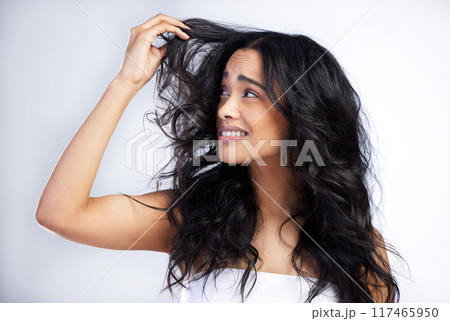 Frustrated, woman and hair loss in studio for care, crisis and unhappy with treatment. Model girl, thinking and stress for texture, split ends and confused or upset for damage by white background 117465950