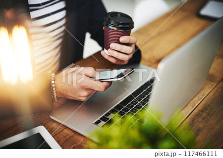 Coffee, phone and laptop with man hands at office with website planning on social media break. Morning, online web designer and creative job with latte and scroll at desk with app design work Coffee, phone and laptop with man hands at office with website planning on social media break. Morning, online web designer and creative job with latte and scroll at desk with app design work 117466111