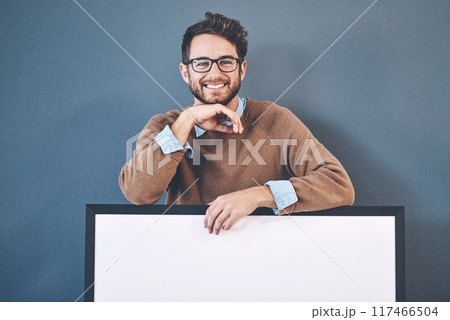 Business, poster and portrait of man in studio for news, announcement and feedback. Mockup space, promotion and happy person with sign, billboard and banner for information on wall background 117466504
