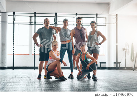 Fitness class, smile and portrait of people in gym for health, wellness and body workout challenge. Happy, friends and group of athletes with personal trainer for exercise together in sports center. 117466976