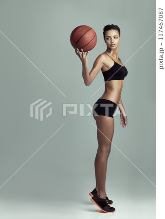 Thinking, woman and basketball on studio background for fitness, training and game. Wellness, Professional athlete and sportsman for workout, challenge and practice for performance with mockup space 117467087
