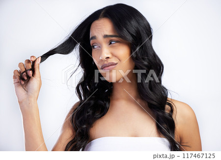 Woman, worried and hair beauty in studio with messy, damage and texture problem of treatment. Female person, sad and alopecia stress, growth fail and scalp crisis or health repair on white background Woman, worried and hair beauty in studio with messy, damage and texture problem of treatment. Female person, sad and alopecia stress, growth fail and scalp crisis or health repair on white background 117467125