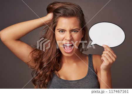 Woman, portrait or frustrated on studio background with speech bubble or mockup space, idea for advertising or social media. Female person, annoyed or empty sign for information, news or notification 117467161