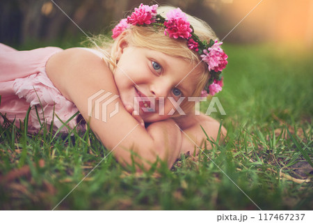 Girl, child and relax with portrait on grass for fresh air in outdoor, playing and happiness with flower crown. Female kid, laying and field for carefree, enjoyment and summer childhood or fun youth. Girl, child and relax with portrait on grass for fresh air in outdoor, playing and happiness with flower crown. Female kid, laying and field for carefree, enjoyment and summer childhood or fun youth. 117467237