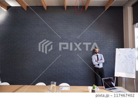 Businessman, portrait and wall with whiteboard for presentation, coaching or conference at office. Man, creative employee or presenter with confidence on mockup space for communication or startup 117467402