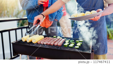 Barbecue, outdoor and friends with sausage and vegetables in backyard for meal at reunion, social event or lunch. Grill, party and men cooking meat and produce for bbq dish on weekend at home. Barbecue, outdoor and friends with sausage and vegetables in backyard for meal at reunion, social event or lunch. Grill, party and men cooking meat and produce for bbq dish on weekend at home. 117467411