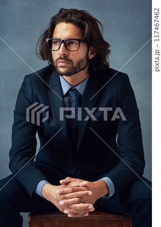 Fashion, suit and thinking with business man in studio on gray wall background for professional career. Corporate, future and planning with confident employee or in pride for elegance, power or style Fashion, suit and thinking with business man in studio on gray wall background for professional career. Corporate, future and planning with confident employee or in pride for elegance, power or style 117467462