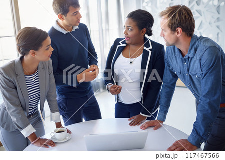 Business people, teamwork and laptop with conversation, brainstorming and professional in modern office. Staff, employees or coworkers with idea, collaboration and diversity with internet and project 117467566