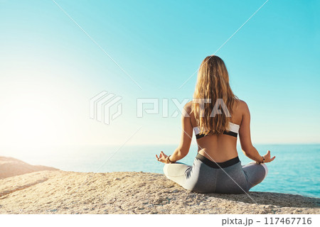 Outdoor, back and woman with chakra for yoga, wellness and spiritual peace in California. Zen, female yogi and hands with lotus pose for meditation, relax and mental health on beach by mockup space 117467716