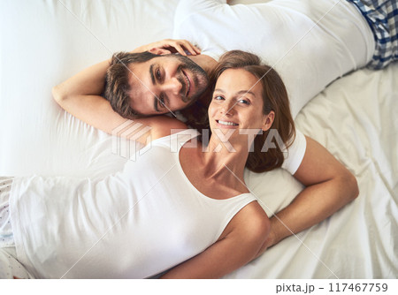Portrait, couple and relax on bed above view of bonding, peace or support for marriage commitment at house. Love, woman and man with embrace care, relationship romance or wake up together on holiday Portrait, couple and relax on bed above view of bonding, peace or support for marriage commitment at house. Love, woman and man with embrace care, relationship romance or wake up together on holiday 117467759