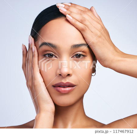 Portrait, model girl and hands on face in studio for skincare, dermatology and glow. Beauty, woman and confidence or pride for cosmetics and wellness by white background for foundation and aesthetics Portrait, model girl and hands on face in studio for skincare, dermatology and glow. Beauty, woman and confidence or pride for cosmetics and wellness by white background for foundation and aesthetics 117467912
