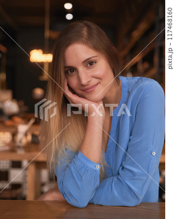 Woman, smile and portrait in coffee shop with confidence for small hospitality business owner. Happy, working and pride for restaurant or cafe with about us, manager and young entrepreneur in France. 117468160