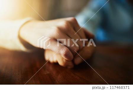 Support, care and trust with hands of people at wooden table together for hope, empathy and love. Anxiety, pain and depression with couple praying in solidarity for help, peace and mental health Support, care and trust with hands of people at wooden table together for hope, empathy and love. Anxiety, pain and depression with couple praying in solidarity for help, peace and mental health 117468371