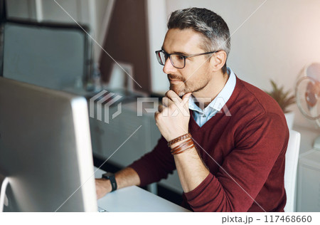 Remote work, man and computer with glasses for thinking, response and research in home office. Male freelancer, technology and idea at desk for communication, review and planning on internet Remote work, man and computer with glasses for thinking, response and research in home office. Male freelancer, technology and idea at desk for communication, review and planning on internet 117468660